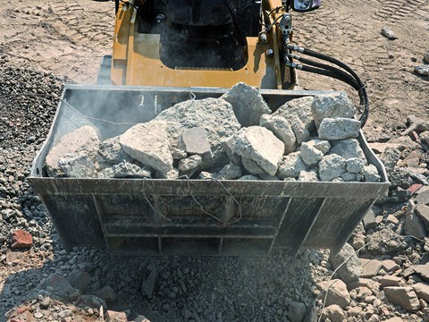 a crusher bucket filled with rocks