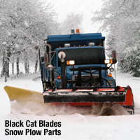 black cat snow plow pushing snow on a truck