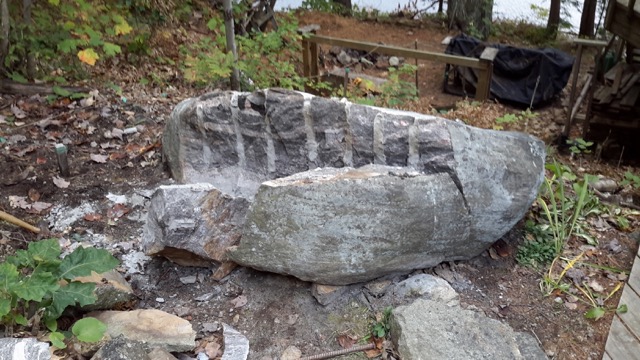 Large rock cleanly split down the middle